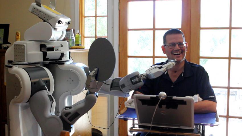 Henry Evans, who lives with quadriplegia, is shaving with a robot. Henry Evans, who lives with quadriplegia, is shaving with a robot.