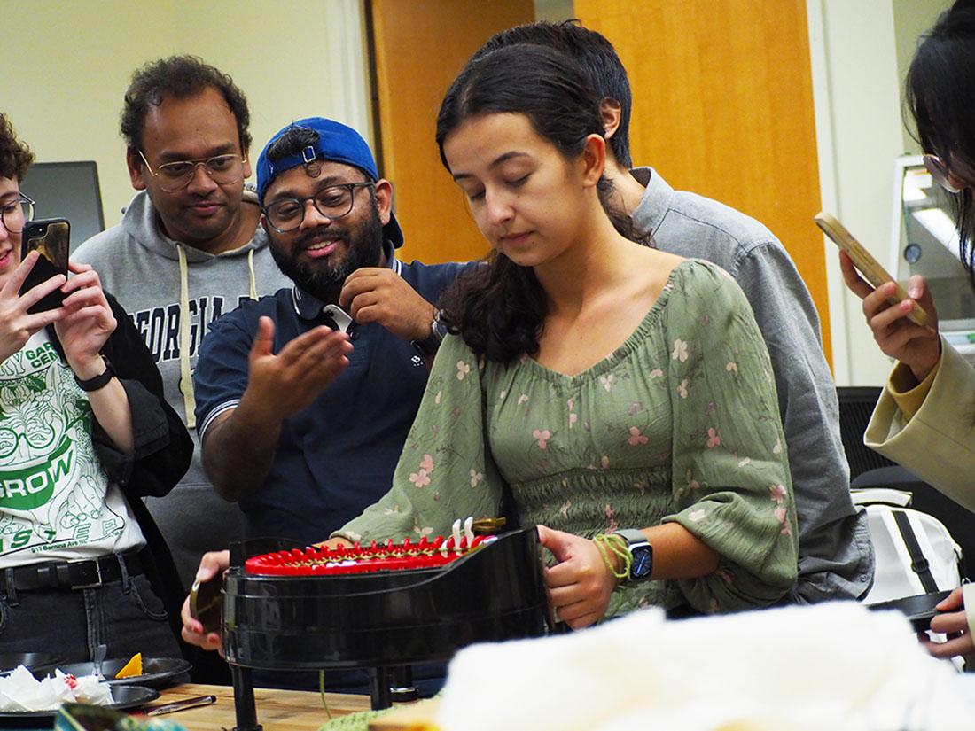 Arianna Mastali (MS-HCI) demonstrates the use of the Craft Lab knitting machine. 